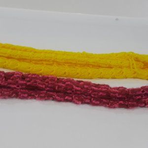 Two scarves, one yellow, the other dark and medium pink